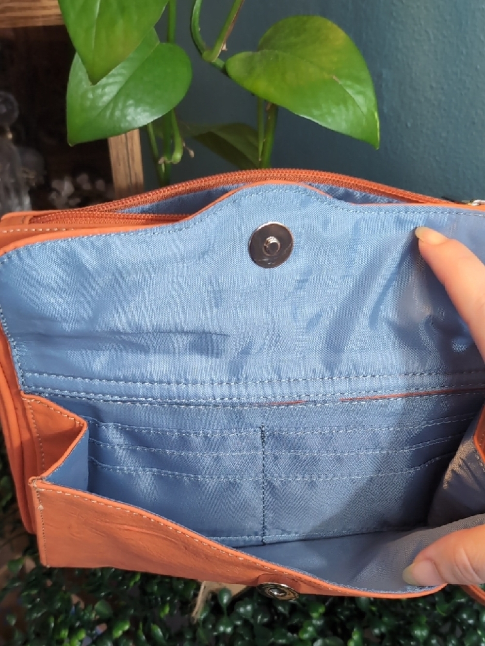 Compact Orange Crossbody Bag with Blue Interior